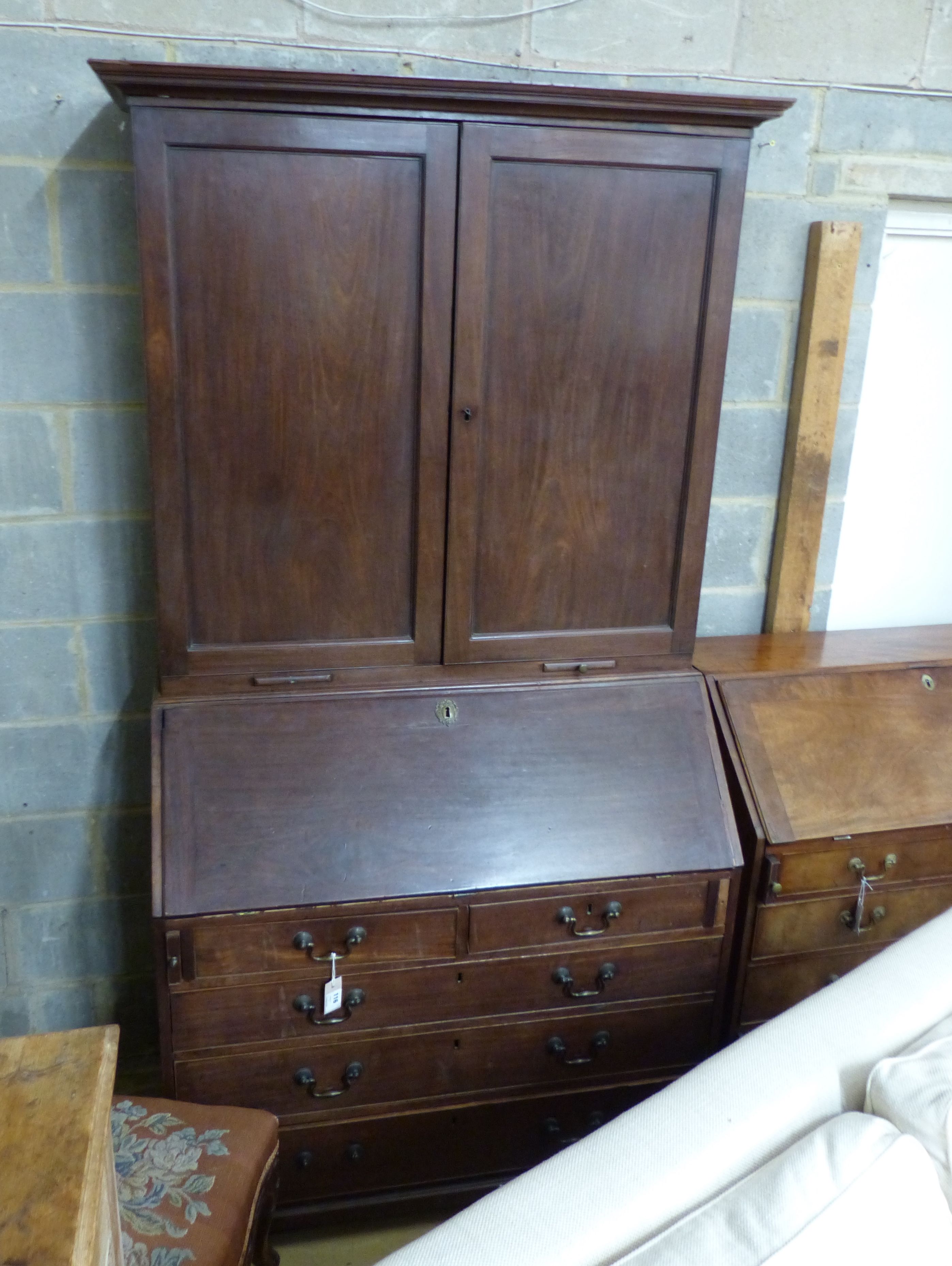 A George III mahogany bureau cabinet, length 111cm, depth 58cm, height 217cm